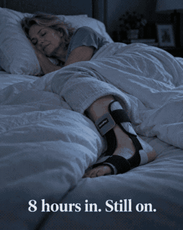 Woman sleeping peacefully with the DorsalFlex on — 8 hours in, still on.